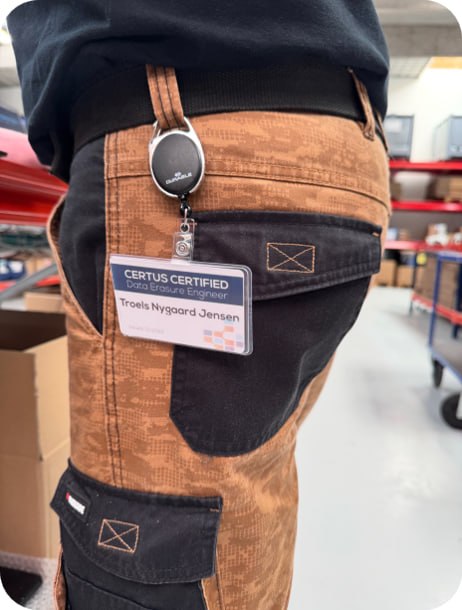 A Scandic IT engineer wearing a Certus Certified Data Erasure Engineer ID badge