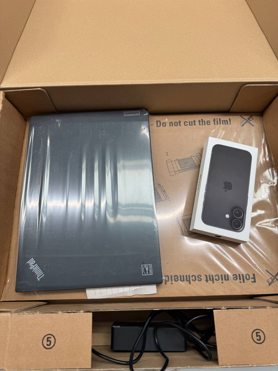 A Scandic IT return kit with a laptop packed securely, ready to ship back
